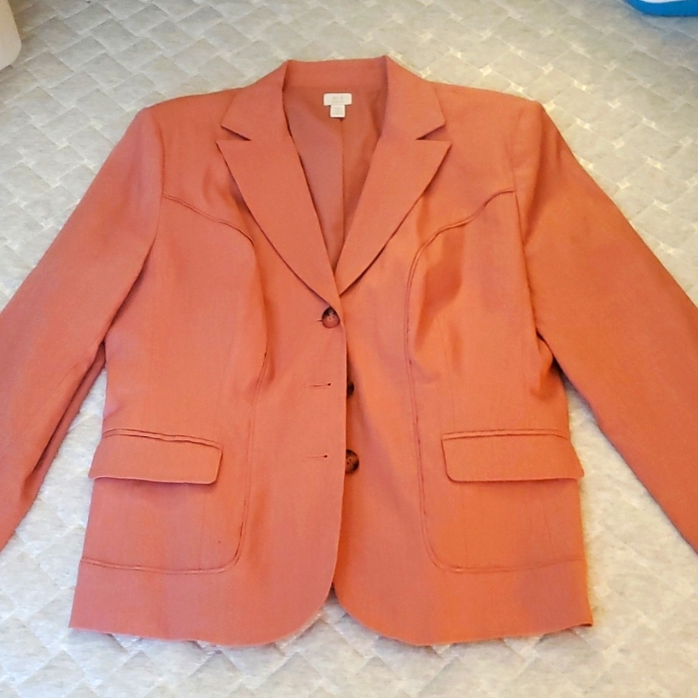 A light Salmon colored Blazer size 16